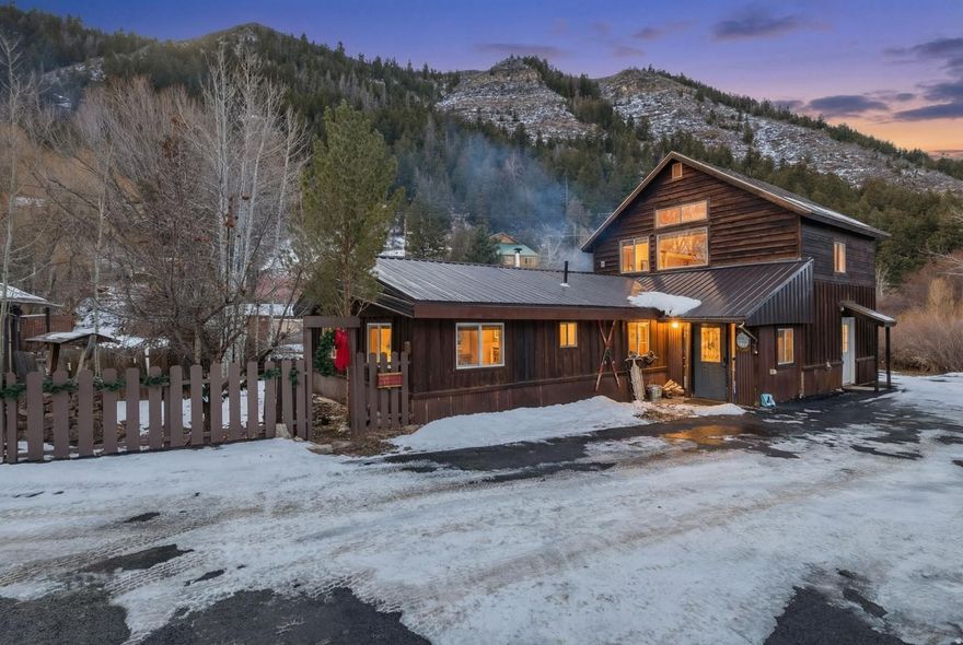 Riverfront property offering world-class trout fishing right from your back patio. Located just 2 miles from world-renowned snowmobiling, 20 minutes to Deer Valley, and 15 minutes to Jordanelle and Rockport Lake. This luxury mountain cabin offers refined rustic living with breathtaking mountain and valley views. The home features 3 bedrooms, 2 bathrooms, and 1,750 square feet, and is sold fully furnished and truly move-in ready. A brand-new traditional sauna provides year-round relaxation after days spent enjoying the outdoors. The home enjoys direct Beaver Creek frontage with year-round access (yes-there are fish), creating a serene and private setting.  An additional adjacent lot (Tax ID SK-44) is included in the sale, adding approximately 0.30 acres and enhancing privacy and future potential. The property offers true year-round access, with an HOA of just $200 per year, which includes road maintenance. Ideally located near the Uinta Mountains and endless outdoor recreation including hiking, fishing, snowmobiling, and trail access, while still a short drive to Park City and Heber Valley. This is a rare opportunity to own a turnkey, high-end mountain retreat, luxury cabin, or legacy property in one of Utah's most scenic settings.