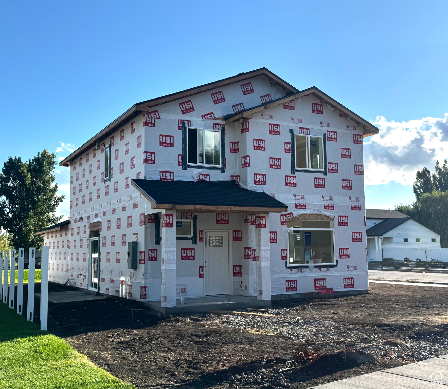 Come see this beautiful brand-new two-story home in Logan, Utah, currently under construction and scheduled to be completed within the next 60 days. Thoughtfully designed, this home offers a bright, open layout with large windows throughout, filling the space with natural light. The kitchen will feature quartz countertops, a large center island with sink, stylish cabinetry, and a side pantry for added storage. Upstairs, the owner's suite will include a ceiling fan for comfort and a spacious bathroom with a walk-in tiled shower, quartz countertop vanity, and a generous walk-in closet. Other planned finishes include durable flooring, modern fixtures, and well-planned storage solutions to make daily living both functional and stylish. The two-car garage will provide ample parking and workspace, while the exterior will be completed with fresh landscaping, a welcoming covered front porch, and a spacious driveway. This home is currently under construction and is expected to be fully finished within the next 60 days. Progress photos may vary slightly from the final details. Located in a new subdivision, this is a fantastic opportunity to own a brand-new home in Logan. Square footage figures are provided as a courtesy estimate only and were obtained from the plans. Buyer is advised to obtain an independent measurement.