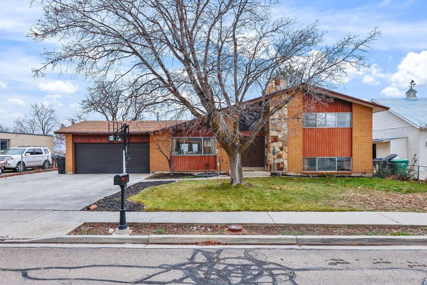 *** AMAZING BACKYARD VIEWS ... COVETED PROVO NEIGHBORHOOD *** Updated home with 2 spacious family rooms, updated kitchen, 3 LARGE bedrooms / 2 bathrooms, wood burning stove, lvp throughout mail level, big covered back patio, attached 2 car garage with workshop, walk out basement.  And did I mention the views!!! Great mountain / valley / lake views out the FLAT usable backyard.  Also has RV parking.