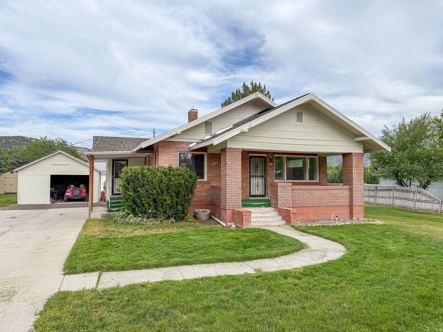 This charming 4-bedroom, 2-bath home at 274 N 300 W offers the character of a classic brick bungalow with many important updates and a great in-town location. Set on a spacious lot, the home features a welcoming west-facing porch that's perfect for relaxing and enjoying Malad's evening sunsets. Inside, the open and spacious floor plan creates a comfortable living environment with plenty of room to gather. The kitchen has been updated with a large island, pantry, and propane range, providing both function and style for everyday living. Two attic rooms add unique character to the home while offering additional storage or flexible space. The property has seen several valuable upgrades, including copper plumbing, Romex electrical wiring, additional insulation, and a roof replacement within the last two years. Located just 1.5 blocks from the new elementary school and conveniently close to the rest of town, this home combines charm, space, and modern improvements in a highly desirable location. Owner is an agent.