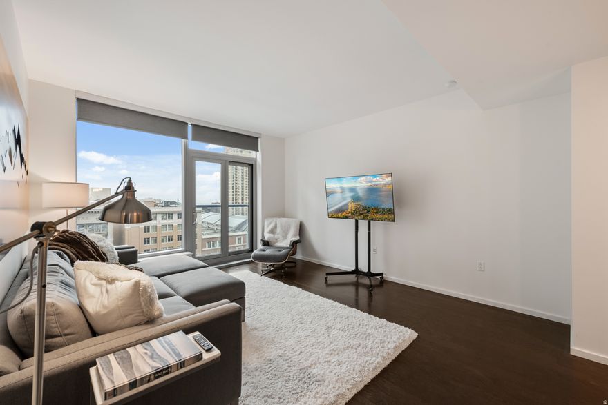 Live in the center of it all in this stylish modern one-bedroom, one-bathroom condo located in the heart of Salt Lake City's Financial District. Designed with an open-concept layout, the residence offers a bright and comfortable living space perfect for both relaxing and entertaining. Enjoy sweeping city skyline and mountain views from your home, along with the convenience of a dedicated walk-in laundry area. Residents have access to exceptional building amenities including a fully equipped fitness room, a beautifully remodeled pool and spa, two invigorating cold-plunge pools, multiple social gathering rooms, and an outdoor BBQ area ideal for hosting friends and neighbors. Step outside your front door and experience the best of downtown living. Premier shopping at City Creek Center, world-class performances at the Eccles Theater, events at the arena, and Salt Lake City's vibrant dining and nightlife scene are all just a short walk away. Commuting is effortless with TRAX light rail service right outside the building, offering a direct ride to the airport in approximately 20 minutes . Whether you're seeking convenience, lifestyle, or stunning urban views  with mountain backdrops , this centrally located condo delivers the perfect blend of comfort and city energy. Square footage cited is based on the architect's drawings and is provided as a courtesy estimate only. Buyer is advised to verify.