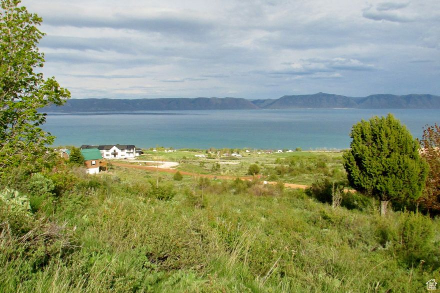 This amazing lot checks off all the boxes for a place for your vacation cabin. Year round access? Check! Great 360 degree panoramic mountain and lake views? Check! Close to wildlife? Check! No nightly rentals? Check! A great value? Check! HOA amenities that includes swimming pools, hot tubs, a 9 hole golf course and best of all private beach access? Check! Check! Check! Come to the quieter side of Bear Lake just across the Idaho border.