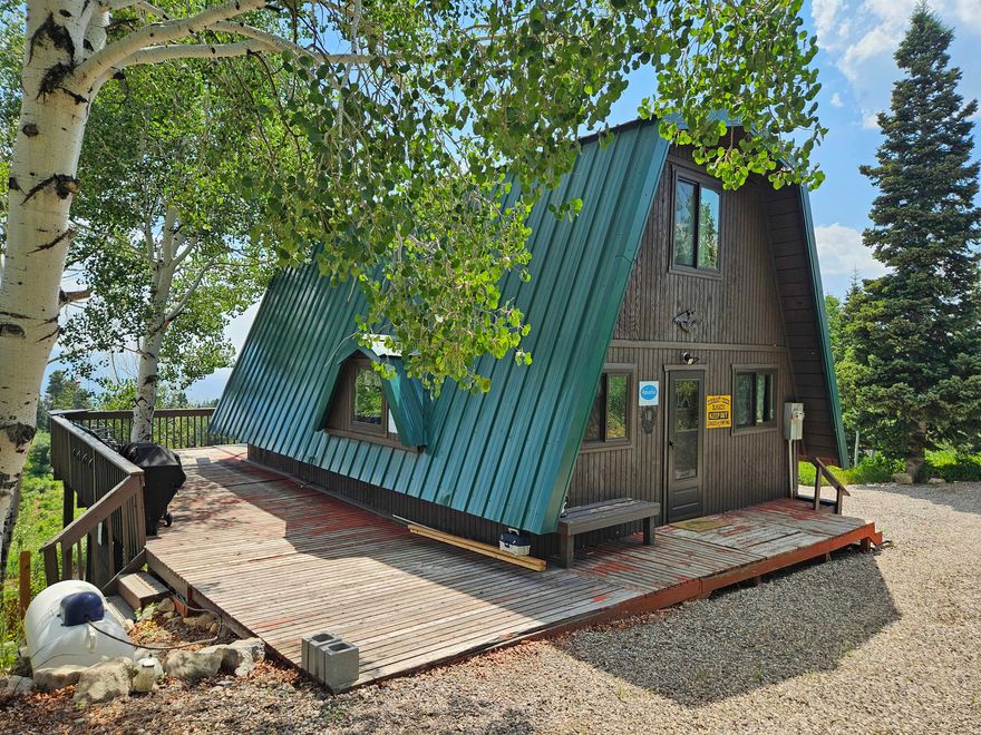 Skyline Mtn. Resort, Lot K53. This is a nice cabin (Recently updated) located high in the mountains of Skyline Mountain Resort. Probably in the most desirable area of the subdivision with abundant pine and aspen trees. There are many amenities located down below such as golf course, swimming pool, tennis courts, pavilion and more. Cabin site has very nice views of the surrounding mountains and valley below. Water source is a community well nearby.