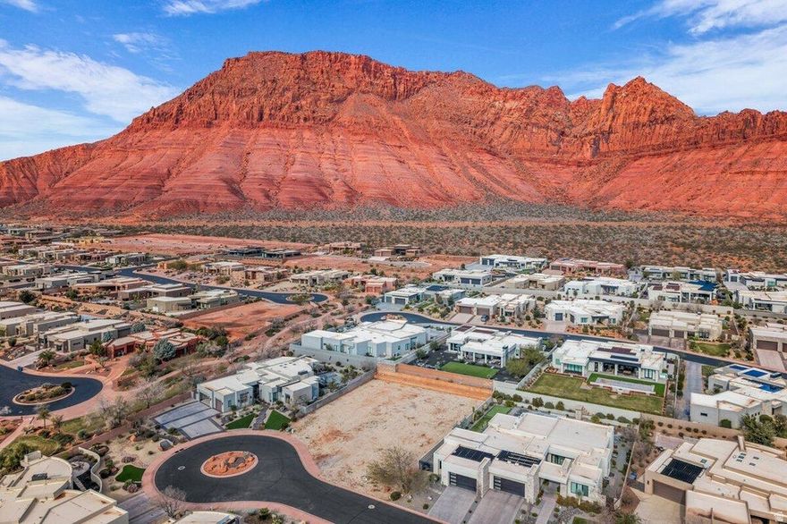 Rare opportunity to own a premium .37-acre lot in a quiet cul-de-sac within the highly desirable, gated Palisades community. Positioned in one of the earlier phases, this property offers the advantage of a fully established neighborhood, no surrounding construction and noticeably lower HOA dues compared to newer developments. Enjoy breathtaking red rock views and ample space to design a custom home with a pool and generous outdoor living. The Palisades is known for its resort-style amenities, including pickleball and tennis courts, a fitness center, clubhouse, and outdoor pool, along with private roads and yard maintenance. The lot features block walls on three sides, utilities stubbed to the property, and Water Impact Fees already paid (approximately an $11, 000 value), making it truly build-ready. Ideally located near Snow Canyon State Park, Tuacahn Amphitheatre, Black Desert Golf Course, Entrada, and just a short drive to Zion National Park, Brian Head Ski Resort, and multiple Southern Utah recreation destinations. Custom home plans have already been designed for the lot and are available upon request. A rare combination of location, value, and readiness in one of Southern Utah's most sought-after communities. Buyer to verify all information, deemed reliable, however buyer to verify all info including utilities, rental restrictions, and HOA information if applicable.