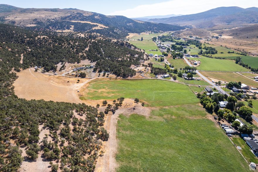 If sweeping views, bucolic landscapes, room for horses, and gently rolling terrain are high on your homebuilding site dream list, then we've got the perfect spot for you. With proximity to small-town conveniences (and accessible upscale amenities nearby in Park City), this is the quiet life that offers the best of everything. A pastoral six acre parcel, you'll find that the front three to be the ideal location for your dream home or cabin (with room for your pasture pals), while the back three lend a hillside dotted with juniper and cedar, giving it privacy and that incredible, high-desert feel. When in need of a fun or relaxing getaway, nearby Blue Sky Auberge offers fine dining, incredible hiking, and a spa-or you can book lunch and a distillery tour at High West in Wanship. Nearby, Echo State Park and Echo reservoir offer summer activities like paddleboarding, camping, boating and swimming (along with ice fishing in the winter for those willing to bundle), while adventurous climbers can enjoy world-class rock climbing in Echo Canyon. Coalville is a small town with some great local eats, like the Polar King, Mister Clucker, Annie B's, Mix's, and so much more. Construction plans for this property are available upon request, and two irrigation shares will convey to the new owner. Other utilities are available off of nearby Chalk Creek Road (as well as an easement to access the parcel). All told? A golden opportunity to build your dream in the scenic hills of this quiet and stunning area.