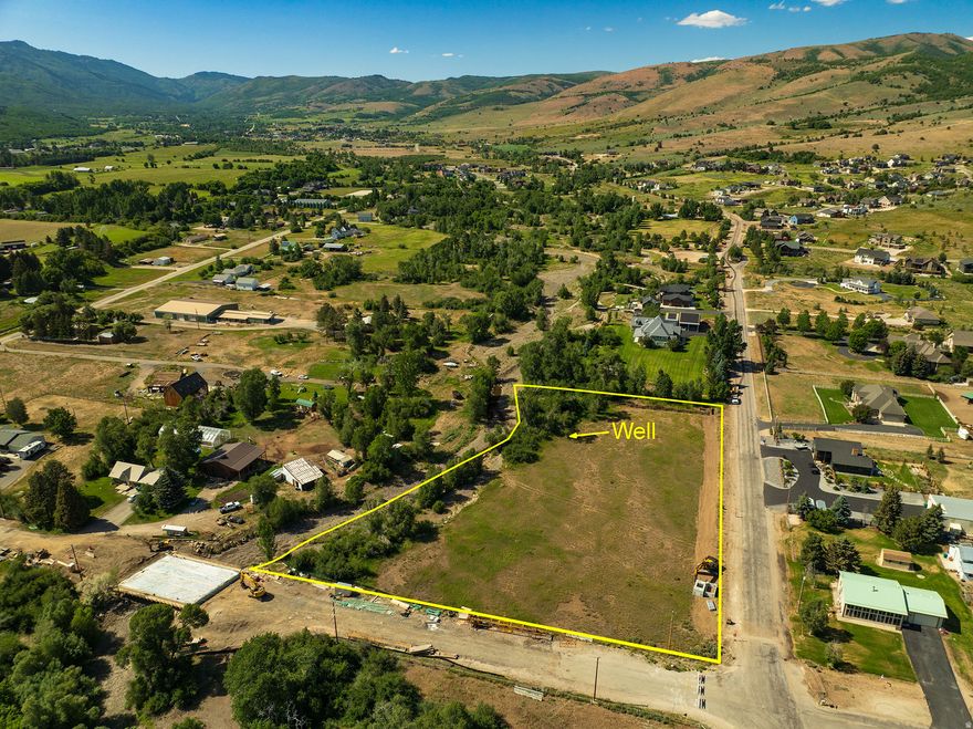Rare Flat Lot in Eden with Private Well and water rights. Discover an extraordinary opportunity to build your dream home on one of Eden's most desirable 3 acre parcels. This rare flat lot offers an ideal building envelope that minimizes the need for costly excavation or retaining walls-saving you time and money during construction. Nestled in the heart of Ogden Valley, the property features a private well and highly sought-after water rights-an increasingly rare asset in this region. A serene river meanders through the land, enhancing the natural beauty and providing a tranquil setting for your future home. Mature trees line the property, offering privacy, shade, and a picturesque backdrop in every season. With no HOA restrictions, this lot provides freedom and flexibility for your vision-whether it's a private retreat, equestrian property, or custom estate. Located just minutes from ski resorts, Pineview Reservoir, and charming downtown Eden, this property blends convenience with rural luxury. Don't miss the chance to own a flat, build-ready lot with unmatched natural features and essential infrastructure already in place.