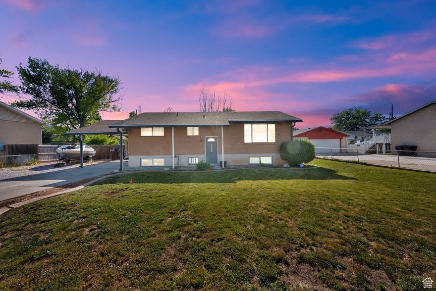 This well-maintained 5-bedroom, 2-bathroom home in Clinton, Utah offers an ideal layout for comfortable living. The open floor plan features a large living area filled with natural light, and a spacious kitchen perfect for meal prep and entertaining. With five generous bedrooms and two full bathrooms, this home provides plenty of space for everyone.  Step outside to a large deck area-perfect for outdoor gatherings-along with a fenced yard and plenty of room for relaxation. The property also includes a carport, RV parking, and a shed for added storage. Situated on a 1/4 acre lot, this home offers ample parking and easy access to nearby amenities, schools, and commuter routes.