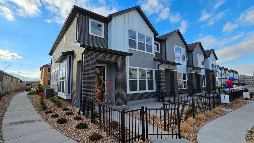 End Residence & Move-in Ready! A New Home for the Holidays Discover your dream home in a brand-new gated community perfectly positioned near scenic parks, shopping, and favorite local dining spots. Just minutes from downtown Salt Lake City and the airport, this prime location truly has it all. Step inside to an inviting open-concept main level that feels instantly warm and welcoming-ideal for gatherings, celebrations, or quiet evenings at home. Enjoy everyday convenience with your modern kitchen located right off the garage-no more lugging groceries upstairs! At day's end, retreat to your spacious owner's suite featuring an impressive walk-in closet and a serene atmosphere designed for relaxation. A versatile loft provides extra space for work, play, or unwinding, while two additional bedrooms offer cozy comfort for family or guests. Every element has been thoughtfully designed-from premium finishes and energy-efficient features that help lower monthly costs to the confidence of an award-winning builder's warranty. This home isn't just move-in ready-it's ready to move you.