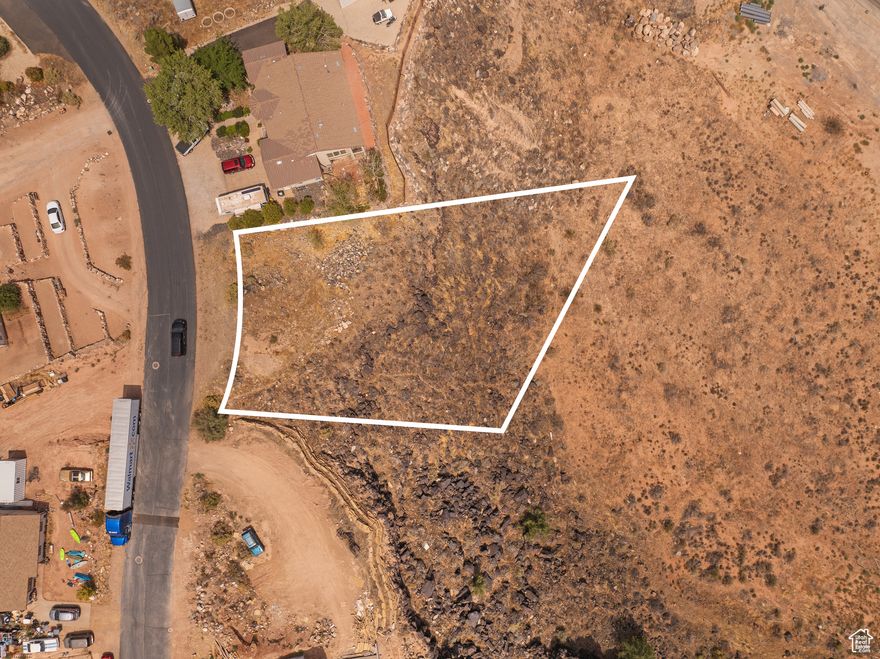 Sweeping Views from the Rim in Toquerville Set along the rim with open views from the back of the property, this 0.58-acre lot offers a stunning backdrop of red rock landscapes and surrounding mountains. The natural slope makes it ideal for a walkout basement design, blending your living space with the outdoors. Utilities are conveniently located nearby, and with no CC&Rs or HOA, you'll have the flexibility to build the home you've envisioned. Sellers have priced this lot with the necessary excavation work in mind, creating an excellent opportunity to secure a view lot in Southern Utah.