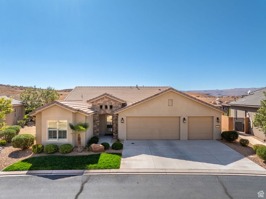 Located on the southern edge of Sun River, this 2-bedroom, 2-bath home with a bonus office combines timeless finishes with modern convenience. A rare find, it features an open floor plan, hardwood floors, quartz countertops, built-in office desk, gas fireplace, and a spacious 3-car garage. Enjoy the privacy of no rear neighbors and endless desert right out your back door. Sun River is Southern Utah's award-winning 55+ community, offering an 18-hole championship golf course, indoor and outdoor pools, pickleball and tennis courts, and more than 80 clubs and groups to join. Set among peaceful, well-kept streets, it's the perfect neighborhood crafted for an active retired lifestyle.