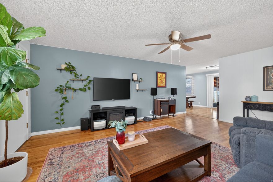 Beautifully updated rambler on a quiet street just steps from the newly rebuilt Hillcrest Elementary. This move-in ready home features a refreshed kitchen with painted cabinets, new backsplash, sink, and appliances, plus new interior paint, updated lighting, and added permanent holiday lighting. Downstairs includes a newly added 5th bedroom, newer carpet, and new baseboards. Buyers will love the spacious basement rec room. Enjoy mountain views, a covered patio, a fully fenced yard, and an attached garage-all in a fantastic location close to parks, shopping, and commuter routes. Square footage figures are provided as a courtesy estimate only and were obtained from county records. Buyer is advised to obtain an independent measurement.