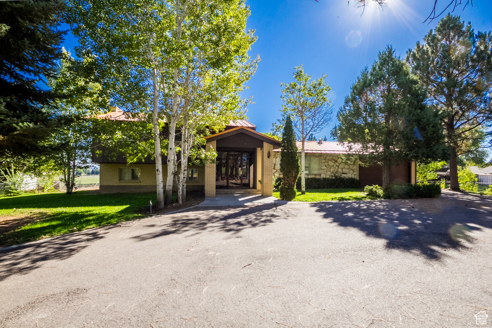 Welcome to this stunning updated home, originally built in 1966, offering a generous 4655 sq ft of living space on a sprawling .83-acre lot. This unique property boasts 4 spacious bedrooms and 3 1/2 beautifully appointed bathrooms, providing ample room for families of all sizes. Step inside to discover two inviting living rooms, perfect for entertaining guests or enjoying cozy family evenings. The thoughtfully designed art studio allows creative pursuits to flourish, making this home an artist's paradise. The exterior is equally impressive, featuring mature trees that enhance the property's natural beauty and provide shade and tranquility. With access to irrigation water, the landscape offers endless possibilities for gardening and outdoor activities as well as wine grapes. Don't miss the opportunity to own this remarkable home that blends updated comforts with classic charm in a serene setting!