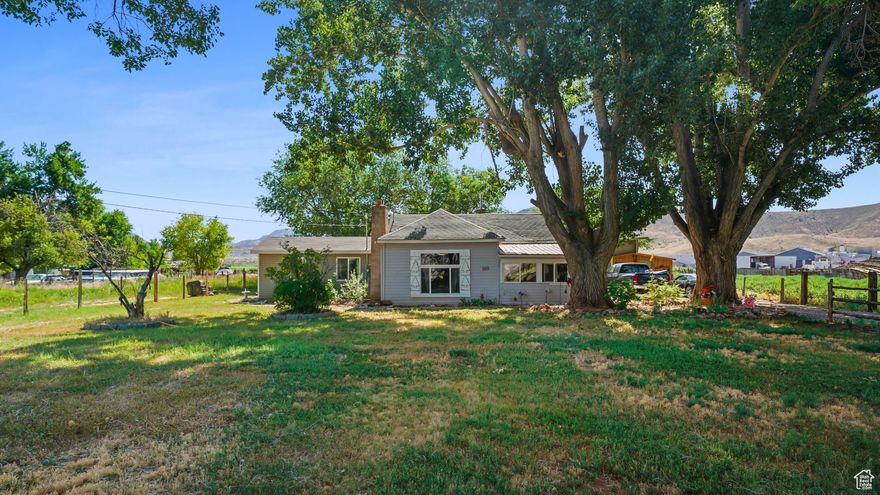 NESTLED BEHIND HUGE SHADE TREES where MR. AND MRS. OWL call home (Owls enjoy their own private wood home a top their favorite tree) sits this AdOrAblE UPDATED CoTtAgE! PRIVATE LIVING AT ITS BEST!  Access the canal right from your land on a hot summer day and  Kayak away and then enjoy the sunset on your Lovely Private Pergola/PaTIO!  ALL OUT BUILDINGS ARE WIRED & HAVE HEAT LAMPS.  HOME COULD BE USED AS A 3 BEDROOM IF DESIRED. GROUND HAS HANDLED UP TO 8 HORSES AT A TIME. RAISE YOUR OWN MEAT, CHICKENS, PLUS PLANT A HUGE GARDEN!!  Includes 1 acre foot well right.  Home is hooked to City Culinary. Very low monthly Utility bills.  THIS HOME IS A MUST SEE AND CHECKS OFF SO MANY ITEMS TO MAKE RURAL LIVING SO SUSTAINABLE! Buyer and buyers agent to verify any and all information.