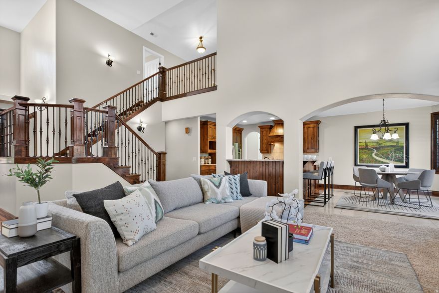 Welcome to this expansive Millcreek residence where thoughtful design meets modern convenience. With over 5,500 square feet, this home offers soaring ceilings, French doors, dark wood accents, and a dramatic double staircase that sets the tone for elegant living. The great room features a gas fireplace, recessed lighting, and oversized ceiling fan, creating a warm and inviting centerpiece. The chef's kitchen is appointed with Bosch double ovens, Viking gas cooktop, Bosch dishwasher, LG stainless refrigerator (with new compressor), granite counters, travertine tile, and a breakfast bar-ideal for gatherings. A main-level laundry with lockers and cabinets keeps everyday living organized. Retreat to the spacious main floor primary suite with a deep jetted tub, dual vanities, walk-in shower with dual shower heads, and custom walk-in closet. Upstairs, generously sized bedrooms offer window seats, walk-in closets, and a dual-entry bath with slate floors and a deep tub. The large unfinished basement (9' ceilings, daylight windows, cold storage, and rough-in for a kitchen, laundry, and bath) provides endless opportunities for expansion. Additional features include: 2 furnaces, 2 A/C units, and 3 water heaters (two new in 2019); Water softener, insulated ductwork, and steel beam construction; Finished 3-car garage with insulated doors, hot/cold spigot, and outdoor RV/tandem parking for 3; Trex decking, vinyl fencing, mature trees, and a full sprinkler system; Smart-home ready with Nest thermostats and Ring camera, this property blends comfort, function, and sophistication-set in the heart of Millcreek. Schedule your private showing today and experience the possibilities.