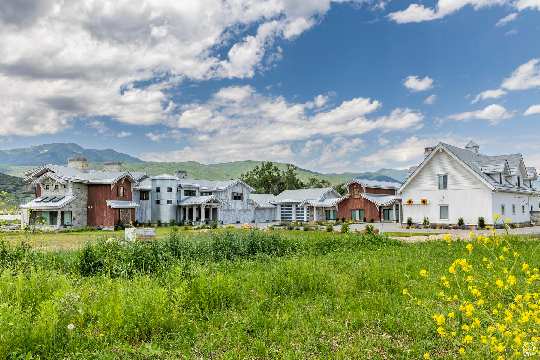 This is a true 'Tuscany Style Masterpiece' home with a Mt. Timpanogos backdrop & 5 acres of horse property. It is as organic as you could possibly get. Every type of outdoor adventure you could want is right outside your door: fly fishing, kayaking, windsurfing, golf, horseback riding, off-roading & so much more! There is a large international airport within an hour & a smaller airport perfect for private air just minutes away. World Class Skiing at the newest ski area in the nation, Deer Valley East Village, is a short drive away & so is Historic Old Town Park City. Deer Creek Reservoir & the Provo River is literally your backyard. The land can accommodate up to 10 horses. The home's golf simulator is so state of the art, not only does it have almost every course, it tee's up the ball for you & the floor actually slants to adjust for pitch of your lie. Going back to the testament of the greener side of this home: Even before the sellers started their custom build, they were extremely conscious of all the materials that would go into building this home. While interviewing contractors, if they didn't have a non-toxic, low, or no VOC type of application, they weren't even considered for any part of the selection. All of the reclaimed wood that was used in (the temp & climate controlled) wine room & barn doors were tested for heavy metals like lead. The outside farmland hay, alfalfa, & bluegrass, grown for the horses, cows, & chickens have never been sprayed with any type of herbicide(add'l 3.5acre adjacent parcel to the north is available if desired inquire for more info). The wells & water are tested yearly to ensure the highest level of purity. The sellers have gone one step further & put a UV light in the ventilation of the house & on the well, no chemicals have ever touched this property. Not only is this one of the coolest homes in the state with all the toys, bells, & whistles but delivered with nicer touches & finishes you'll find elsewhere.