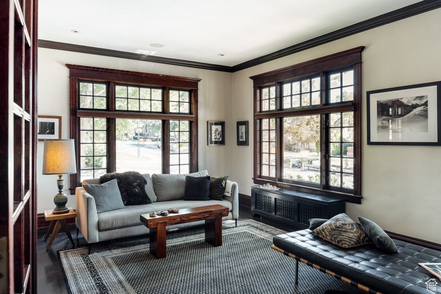 Perched inside one of Salt Lake's most iconic buildings, this Maryland residence strikes the rare balance between historic charm and modern comfort. The bones are classic Beaux-Arts, but this particular unit comes with a few surprises you won't find anywhere else in the building. Step inside and you'll find soaring ceilings, moody dark original woodwork, and the kind of architectural detailing that made the Maryland building a mainstay on South Temple. Original French doors-still intact here, though not in every unit-function perfectly to negotiate the spaces, offering both autonomy and connectivity depending on the need. The kitchen carries its own historic story, with original mosaic tile floors thoughtfully preserved alongside gorgeous limestone countertops and chef-grade appliances, including a Wolf range, Sub-Zero refrigerator, and industrial hood. Spacious counters and a generous dining room make cooking and entertaining as easy as it is elegant. The building-and this unit in particular-overflow with original charm, but you'll also find modern conveniences. This home is one of the few units with built-in A/C, plus rare in-unit washer/dryer hookups that make daily life as effortless as it is stylish. The bedroom has been thoughtfully outfitted with soundproofing, so serenity is always in reach. Outside, your deeded parking spot is tucked inside the private carriage house, an attached and covered convenience that makes downtown living both easy and secure. Add in the large storage unit (because we know square footage is only part of the story), and you've got historic beauty with modern practicality. This one is as unique as they come-historic elegance with just the right dose of luxury and ease. Best advice? Set up a showing before it's gone.    Square footage figures are provided as a courtesy estimate only and were obtained from county records.  Buyer is advised to obtain an independent measurement.