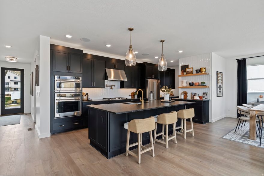 Own a professionally designed MODEL HOME in an amazing community nestled in the foothills of Saratoga Springs. This light-filled home features an open layout, spacious bedrooms, and a thoughtfully designed kitchen with abundant cabinetry and a walk-in pantry. The walk-out finished basement adds valuable living space, complete with a wet bar-perfect for entertaining or relaxing. Enjoy mountain views, nearby parks, and quick access to ATV trails, with shopping and dining just minutes away, including Costco less than four miles from home. A fully landscaped yard completes this rare, move-in ready opportunity in a prime location.  All furnishing and decor available at an additional cost.