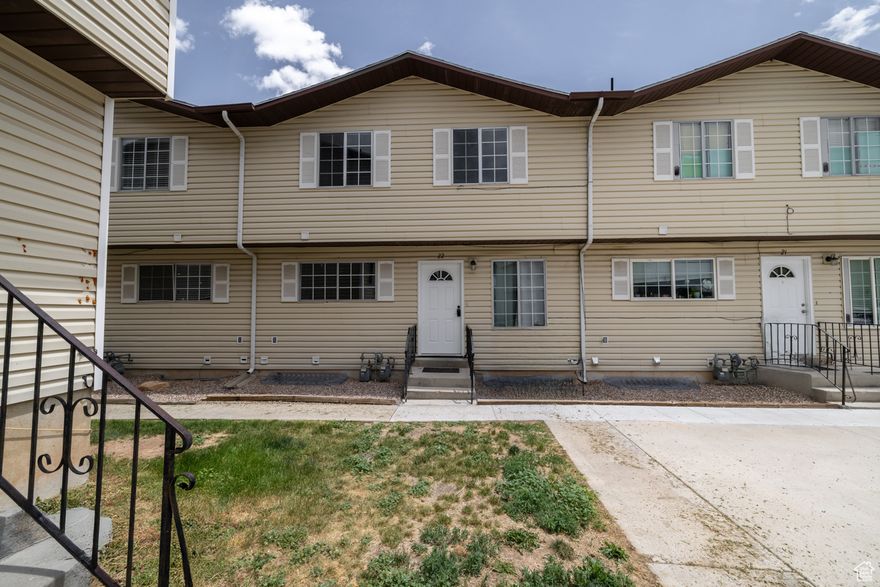 Great Investment Opportunity! This middle-unit provides low maintenance living with 2 bedrooms, 1 1.2 bathrooms, and an unfinished basement for storage. Newly updated with LVP flooring throughout and new paint. Information provided as a courtesy, buyer to verify all information.