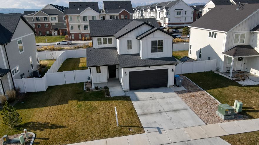 Modern living meets total convenience in this stunning 2022 American Fork home! Featuring 3 bedrooms, 2.5 bathrooms, and an open-concept layout designed for both comfort and style. The beautifully designed kitchen showcases elegant granite countertops, modern finishes, and flows seamlessly into the main living areas with stylish LVP flooring throughout. Step outside to your private, fully fenced backyard retreat complete with a covered patio-perfect for relaxing evenings, entertaining guests, or enjoying Utah's beautiful seasons. Sitting on a spacious 0.14-acre lot, this property also offers a 2-car garage and ample parking. Best of all, you're just a short walk from the FrontRunner and only minutes from freeway access, parks, shopping, dining, and schools-making commuting and everyday living incredibly convenient. Move-in ready and packed with modern charm, this is one you won't want to miss!