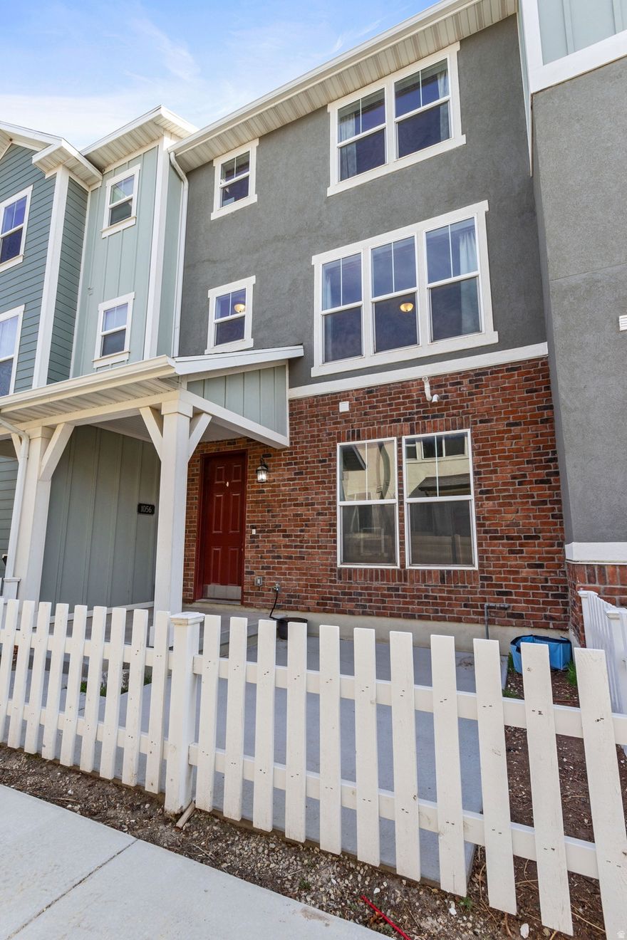 Enjoy multi-level living with the added benefit of a two-car garage. This prime location offers easy freeway access between Utah and Salt Lake County. Tall ceilings and well-placed windows bring in consistent daylight without sacrificing wall space for art and furniture. Durable, low-maintenance flooring ties public spaces together for a cohesive look that withstands heavy traffic. Deep, under mount kitchen sink with quartz countertops. Both upstairs bedrooms are en suite. Finish the bathroom on the main and have a rentable room and bath.