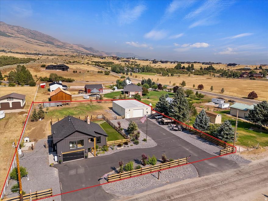 Set on over an acre in the heart of Ogden Valley, this property isn't just a house-it's a fully built-out lifestyle. Thoughtfully redesigned four years ago, every inch of this home and property has been dialed in for simplicity, efficiency, and adventure. Inside, the home offers 4 bedrooms and 3 bathrooms with a clean, updated feel that balances comfort and function. But what truly sets this property apart begins the moment you step outside. Anchoring the property is a massive 40x60 shop, offering expansive garage space along with a fully finished gym space and sauna. It's a setup that's hard to recreate and even harder to find, built for those who want space to work, train, and live all in one place. The land itself opens up endless possibilities. With pasture space for animals, custom timber fencing, mature trees, and a private pump track, this property invites you to slow down, spread out, and enjoy the lifestyle Ogden Valley is known for. Evenings are best spent in the shaded backyard or gathered around the fire pit with unobstructed views stretching toward Nordic Valley. This isn't your typical Ogden Valley home. This is your basecamp.