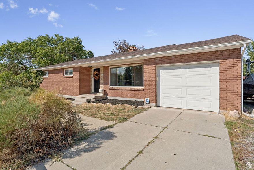 Welcome to this cute red brick rambler in East Bountiful offering timeless charm with thoughtful updates throughout. Featuring 5 bedrooms and 2 full bathrooms, it has plenty of space and flexibility for any lifestyle.  Inside, you'll find an upgraded kitchen featuring granite countertops, stainless steel appliances, and a gas stove - a perfect setup for those who love to cook. The brand-new LVP flooring adds a clean, modern look and is built to last. The walkout basement offers ample potential for an additional living space, a home gym, or a future rental unit.   Outside, the property includes a carport with hot tub hookups and a large back yard with room to create the outdoor space of your dreams.  Conveniently located near schools, parks, and shopping, this home offers a fantastic opportunity to add your personal touch and make it your own.  Classic brick construction, great bones, and tons of potential. Come see it today!