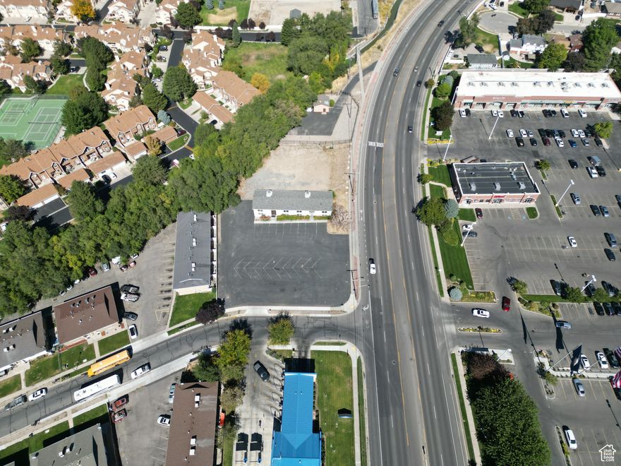 Introducing a prime investment opportunity at 7720-7708 S 700 E, Midvale, UT. This 5,626 SF building, situated on nearly 1 acre of commercial land on a corner intersection. The existing structure was built in 1977, and it offers an investor a covered land play. This lot is Zoned Commercial Neighborhood and has stellar development potential and flexible options. All 4 parcels for sale total to .93 Acres, which is ample space for 15,000+ Square feet of medical office or roughly 9,000 Square feet Retail. Don't miss this chance to claim your stake in a distinguished commercial real estate asset.   The existing building is 5,626 SF and has several bullpen areas as well as 9 offices. Previously used as a call center and currently the infrastructure is in place for a phone system. The building features 13 Rooms that can be used as offices, and downstairs has an expansive bull pen area. As far as development potential, Commercial, Retail, and Office uses are all approved uses with 40 foot building heights and roughly 15,000+ of new space can be developed here.   Offices with a convenient location with good parking and access.