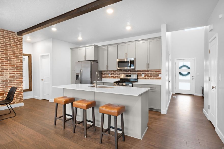 Are you sick of touring the same old boring townhomes that smell like cats, have beige-on-beige everything, and come with a "community pool" that somehow has 6,000 kids there at all times? Same. Good news-this one actually has a personality. Instead of fighting for pool space like it's Splash Summit in July, this community offers a private pond with a sandy beach. Yes, a beach. You can sit in the sand, pretend you're on vacation, and still make it home in time for Sunday dinner (Don't worry we won't tell Bish). And because this is Utah, of course there are private pickleball courts. Morning games, evening matches, and a great way to pretend you're being "active" while still calling it social time. The home itself is immaculate-new carpet, near-perfect condition, and so clean it feels like a brand-new build with all the upgrades... minus the "we'll finish it in 18 months" timeline. The main floor features an open-concept layout that doesn't feel like a hallway pretending to be a living room. Upstairs you'll find 3 bedrooms and 2 bathrooms, including a spacious primary suite with million-dollar valley views-the kind you'll post on Instagram with a "#blessed" caption and absolutely mean it. Downstairs, the basement has its own walk-out entrance that leads straight to a walking path. Perfect for guests, a future rental, or quietly escaping your kids when they've had one too many energy drinks and sugar cookies. Utah things. Bottom line: this isn't your average townhome. It's clean, upgraded, has killer views, a pond-with-a-beach, and private pickleball courts-which officially puts it in the top tier of Utah living. See it before you end up settling for another cookie-cutter place with zero vibes.