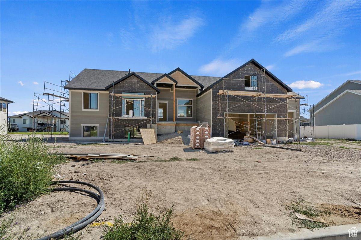 Check out this custom-built 3-bedroom, 2.5-bath home located in what is becoming an established Farr West neighborhood. Designed for comfort and modern living, the open-concept layout features vaulted ceilings, durable LVP flooring in the main living areas, and cozy carpeted bedrooms for added warmth. The spacious kitchen and living area are perfect for entertaining, with large windows that offer soft views of the nearby mountain backdrop. From the kitchen, step out onto a spacious back porch-a perfect spot for outdoor dining, relaxing, or enjoying the peaceful surroundings. The primary bedroom includes a walk-in closet, double sinks, a soaking tub, and a separate tiled shower. An unfinished basement offers potential for future expansion, while the 3-car garage provides ample space for vehicles, storage, or hobbies. This home is the perfect mix of style, function, and location. Don't miss your chance to own a brand-new home in one of Farr West's most desirable communities. Schedule your showing today and make it yours!