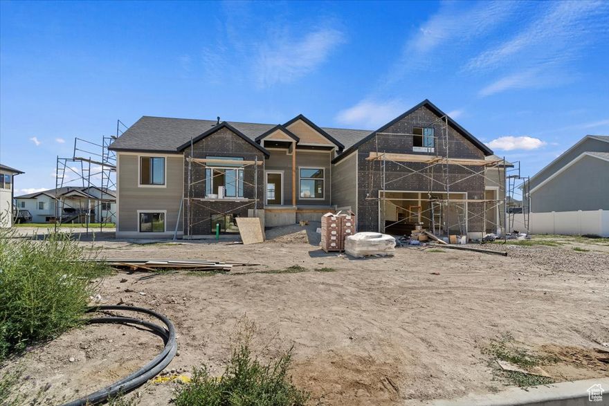 Check out this custom-built 3-bedroom, 2.5-bath home located in what is becoming an established Farr West neighborhood. Designed for comfort and modern living, the open-concept layout features vaulted ceilings, durable LVP flooring in the main living areas, and cozy carpeted bedrooms for added warmth.  The spacious kitchen and living area are perfect for entertaining, with large windows that offer soft views of the nearby mountain backdrop. From the kitchen, step out onto a spacious back porch-a perfect spot for outdoor dining, relaxing, or enjoying the peaceful surroundings.  The primary bedroom includes a walk-in closet, double sinks, a soaking tub, and a separate tiled shower. An unfinished basement offers potential for future expansion, while the 3-car garage provides ample space for vehicles, storage, or hobbies. This home is the perfect mix of style, function, and location.  Don't miss your chance to own a brand-new home in one of Farr West's most desirable communities.  Schedule your showing today and make it yours!