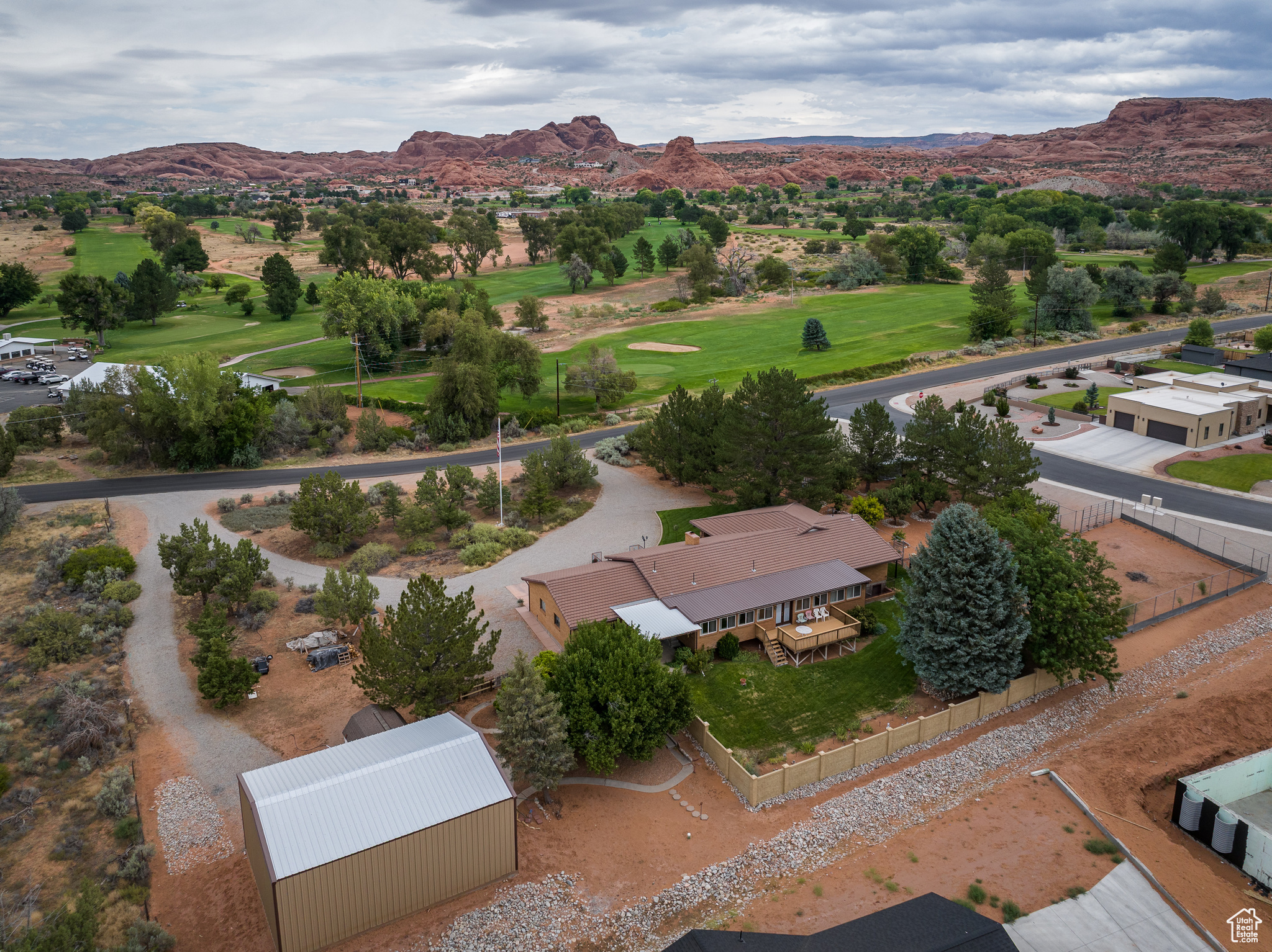 A truly rare opportunity to own one of Moab's most desirable residential properties-1.53 acres directly adjacent to the Moab Golf Course. Featuring a 3,379 sq. ft. custom-built home with an attached 2-car garage and additional shop space, offered for sale by the original owner/builder for the very first time. The home reflects the quality construction of its era and has been exceptionally well cared for, with thoughtful design elements including multiple living spaces, fireplaces, expansive decks and patios, mature landscaping, and fruit trees. While some finishes remain in their original style, the solid craftsmanship provides the perfect canvas for updating to your personal taste. Set on a large parcel with sweeping views of the red rock, and La Sal Mountains, this property combines privacy, space, and immediate access to Moab's golf and recreation lifestyle. Whether as a primary residence, second home, or legacy estate, this is an unparalleled chance to secure a premium location that rarely comes to market.