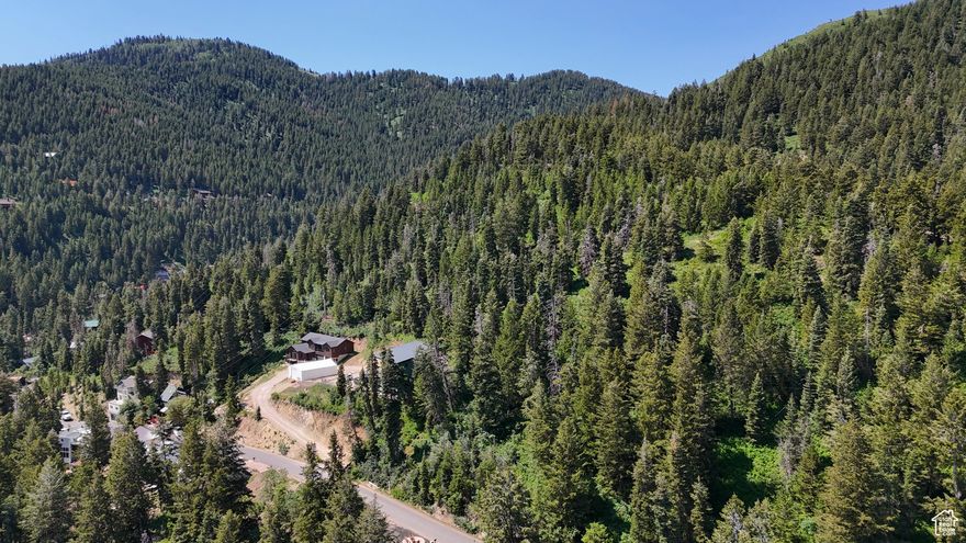 Prime uphill lot with included building plans and survey! An exceptional value with mountain and valley views in a highly desirable Park City neighborhood. Situated in the Park City School District, this property is only minutes away from Deer Valley and Park City ski resorts. The uphill slope offers an opportunity for a backyard and patio. Save yourself valuable time and expense with the included building plans for a three-bedroom, three-bath home with an office and open-concept living and kitchen area. Summit Park boasts some of Park City's best trails and backcountry skiing. With public open space directly behind the lot, you can backcountry ski from your own doorstep. Neighborhood streets are maintained by the county, with public utilities located on the street. Don't miss this chance to create your mountain retreat in the heart of the Wasatch!