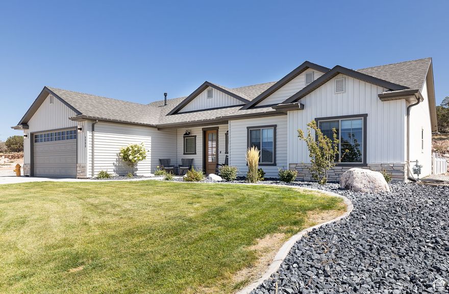 Tucked away in the peaceful 4B Ranch community, this 4-bedroom, 2-bath home combines modern design with a rare sense of space and freedom.2023  an acre including the lot to the north. Sunsets are stunning here-this west-facing lot captures golden light spilling across the mountains each evening. The detached 600 sq. ft. shop expands your possibilities, whether for hobbies, storage, or side projects, and the 4-car garage makes room for toys and tools alike. Inside, you'll find an airy open floor plan with tall ceilings, abundant natural light, and a generous walk-in pantry that anchors the heart of the home. Thoughtful touches-like luxury vinyl flooring, energy-efficient windows, and a gas fireplace-make daily living as comfortable as it is stylish. This isn't just another house on a lot. It's a place designed for space, sunsets, and slowing down.