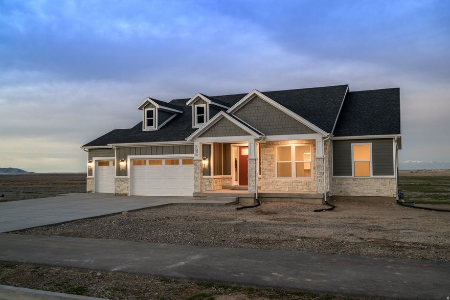 Brand New Homes in Grantsville City is finished and ready for immediate move-in! This Brodie floorplan offers spacious rooms, grand owner suite bathroom, large closets, open spaces and a covered deck! The unfinished basement has a separate basement entrance perfect for a future attached ADU. Options for out buildings, animals, including horses, and more! Great size lot at .85 acre!