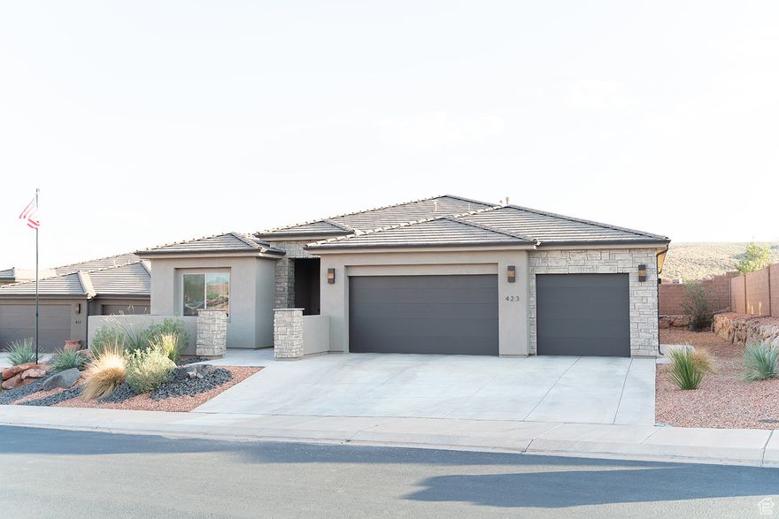 **Best Priced Home in Mojave Mesa!** Comfort, quality, and breathtaking scenery come together in this beautifully maintained single-level home. With 2,508 sq. ft., 4 bedrooms, 3.5 bathrooms, and a 3-car garage, this 2022-built home feels like new and is now offered at an incredible value due to a job relocation.  Inside, the bright open floor plan features large picture windows, a cozy gas fireplace, and a stunning kitchen with quartz countertops, sleek cabinetry, a walk-in pantry, and double ovens. The spacious primary suite includes a spa-like bathroom with a soaking tub, walk-in shower, and custom closet, while a guest ensuite offers extra comfort and privacy. Custom window coverings add thoughtful detail throughout.  Enjoy a fully landscaped yard, covered patio, and climate-controlled storage room, plus red mountain views from your front courtyard. Just minutes from downtown St. George, world-class golf, and endless outdoor adventure-including Zion, Bryce, Snow Canyon, and Sand Hollow-this home offers the best of Southern Utah living.  Move-in ready, priced to sell, and located in one of the area's most desirable communities-this is an opportunity you don't want to miss!  All information deemed reliable, buyer to verify.