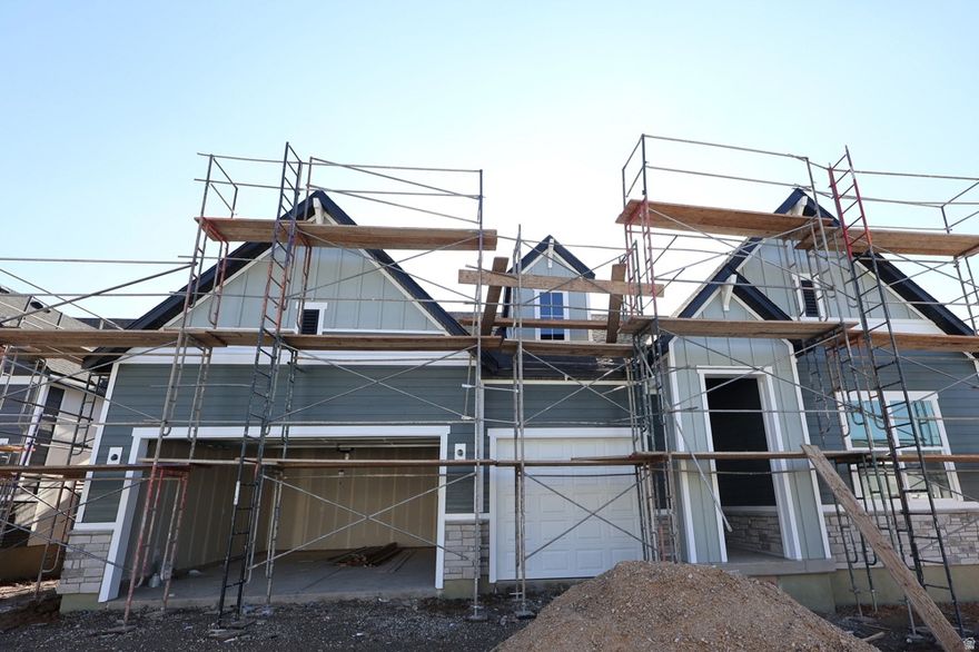 Welcome home to this beautiful rambler floorplan by David Weekley Homes. The "Bromley" showcases one level living with 10' ceilings and an open staircase. Imagine the gatherings and memories you'll make baking cookies with the gas range and decorating them on the large quartz island. Afterwards, you may find yourself with your feet up next to the warmth of the fireplace. Enjoy each morning with mountain views and maybe a deer or two from your elevated deck. The oversized owners bedroom leads to a luxurious soaker tub and not one but TWO walk-in closets!  Located in the sought-after community of Eastridge Park in East Layton, surrounded by scenic and majestic views, city parks and trails, lifestyle amenities, and highly regarded Davis School District schools. Don't miss this rare opportunity to live in a brand new home in an established East Layton neighborhood. Only 7 minutes to shopping at Station Park and just an easy 30 minute commute to downtown Salt Lake City. David Weekley Homes has been building dreams and enhancing lives since 1976.