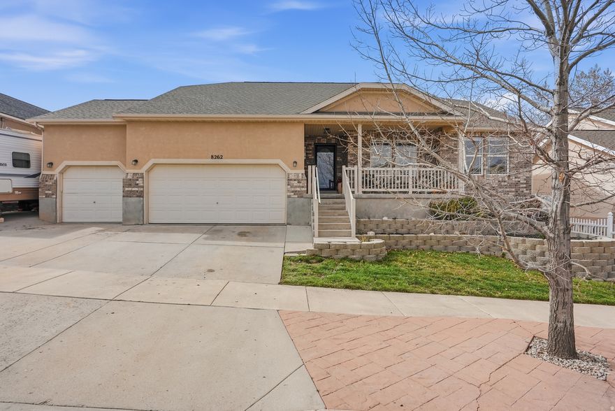 SELLER IS OFFERING $6,000 toward CLOSING COSTS when you use our preferred lender...***...   Beautiful RAMBLER / MAIN LEVEL LIVING with nearly 4,000 sq ft, a 3-CAR GARAGE & RV Parking.  Step inside, you'll fall in love with the OPEN LAYOUT, VAULTED CEILINGS, COZY FIREPLACE, and big windows that bring in natural light.  The spacious Primary Bedroom includes an Ensuite Bathroom with Double Vanity, a Tub and an Enclosed Shower, as well as a Walk-in Closet!  The 3-CAR GARAGE & RV PARKING provide plenty of space for all your cars and toys.  The HUGE backyard is your own OASIS! Enjoy cozy evenings with friends and family around the built-in FIREPIT, plus, fun summer BBQ gatherings!  The 20% finished basement gives you ROOM TO EXPAND. More living space for your family and your creativity, turn it into whatever you desire!! Renovated flooring and countertops  LOCATION is unbeatable! WALKING DISTANCE to both Oakcrest Elementary and Sunset Ridge Middle School. Just minutes to Smith's, Walmart, Harmons, as well as restaurants and entertainment.  This is the home you've been looking for - come see it today!    Information and measurements are provided as a courtesy. Buyer is advised to see the home in person and obtain their own measurements and verify all information.