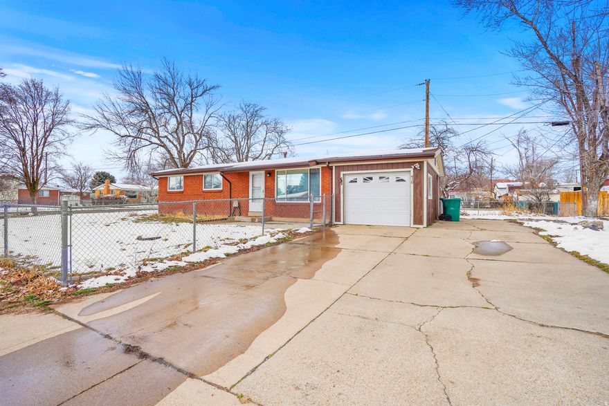 Beautifully updated 3-bedroom, 1-bath brick rambler offering 1,000 sq ft of comfortable single-level living on a spacious .19-acre fully fenced corner lot. Recently updated, this move-in ready home features granite countertops, subway tile backsplash, stainless steel appliances, gas range, updated flooring, newer roof, and fresh paint. Bright living room with custom wood accent wall. Dedicated dining area with sliding door to backyard. Attached 1-car garage, extended driveway, Large RV pad, storage shed, central A/C, and no HOA. Conveniently located just minutes from I-15 and Layton Hills Mall for easy commuting and shopping. An ideal updated ranch and perfect starter home opportunity you won't want to miss! SELLER FINANCE AVAILABLE!