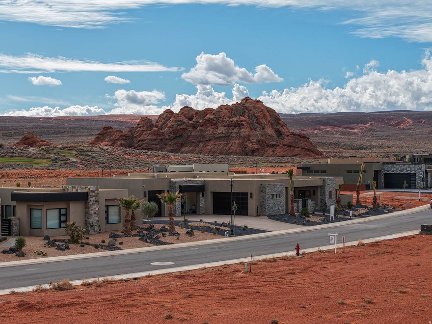 Welcome to The Estates at Sand Hollow Resort- Your gateway to luxury living and nonstop adventure! This brand-new custom home crafted by Utah Oasis Homes sits proudly within the Estates and delivers approximately 3,900 sq. ft of stylish, high-end comfort. Step inside to discover European white oak hardwood floors throughout, four private ensuite bedrooms, a dedicated office, six bathrooms plus a pool bath and an oversized 5 car garage for the boat and all the toys. The backyard is pure vacation mode with pool and hot tub, huge covered patio with misters, built in BBQ and outdoor fire pit- all perfectly positioned to soak in the sun and those jaw-dropping red rock, golf course and mountain views. This home is loaded with thoughtful upgrades that take everyday living to the next level: motorized blinds, artistic wall texture, stunning quartz countertops, multi-slide doors, a large soaking tub in the primary suite, designer-selected custom tile finishes, an oversized laundry/craft room, a pass-through window from the panty to the outdoor BBQ area, plus a full security and sound system for comfort and peace of mind. And the location- It doesn't get better.  You're minutes from Sand Hollow Resort Golf Course, Sand Hollow State Park, and the sand dunes - Southern Utah's outdoor playground is literally at your doorstep.  Move-in ready with immediate occupancy.  All information deemed reliable; buyer to verify all.
