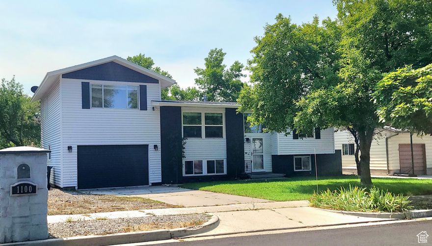 Tucked back into a family neighborhood is an updated split-level in Eastside Sandy with major curb appeal! The white Quartz countertops in the kitchen and laundry room make both rooms feel fresh. The kitchen has large ceramic tiles and stainless steel appliances, white cabinets, and a pass-through bar, making for a modern and open space. The large bonus room over the garage, with vaulted ceilings and recessed lighting in addition to the covered deck with a wide staircase, creates the perfect home for large group gatherings. The fully fenced, well-shaded backyard makes the home pet- and kid-friendly. Large energy-efficient windows flood each room with natural light. Most of the windows have large slatted wooden blinds. The master bedroom off the kitchen has an oversized jetted tub, a standalone shower, a walk-in closet, and an extra storage nook. The 3 bedrooms in the basement each have large windows and nicely sized closets. The large laundry/hobby room has designer vinyl flooring and a utility sink next to the stacked washer and dryer. The downstairs bathroom is fully updated and modern. Walking distance to Quarry Bend shopping center, Bear Park, and the Sandy Amphitheater. The elementary and Junior high schools are also within walking distance. The high school is Jordan High. This home is a must-see!! Square footage figures are provided as a courtesy estimate only and were obtained from the county.  Buyer is advised to obtain an independent measurement.
