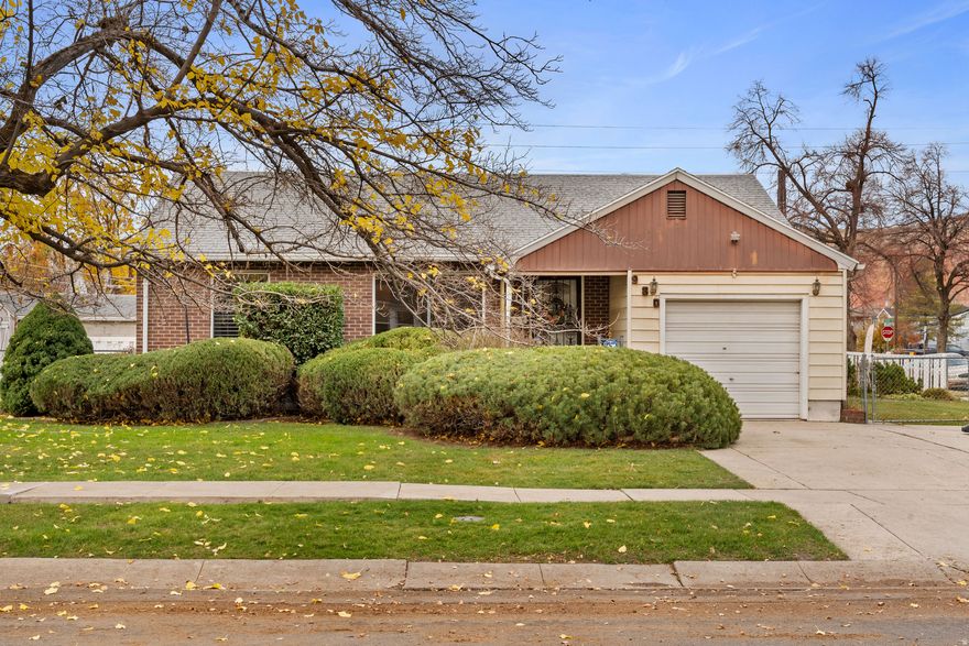 This charming bungalow sits on a peaceful, tree-lined street in Rose Park, blending classic appeal with modern comfort. Enjoy a fully fenced yard perfect for children, pets, or unwinding outdoors. The home's location is just a short stroll to an elementary school and close to downtown Salt Lake City, parks, and local amenities-offering both convenience and character. Inside, the main floor features two, a living room, bedrooms with built-ins, a spacious kitchen with a breakfast nook, plantation shutters,, and a full bathroom. Downstairs, you'll find a generous family room,   another bedroom with built-ins, a bathroom, and a craft room with additional storage. Oh yes and laundry. Brand new furnace with transferrable warranty. The attached garage and deep driveway provide ample parking. This rare opportunity offers space, privacy, and future potential-don't let it slip away!