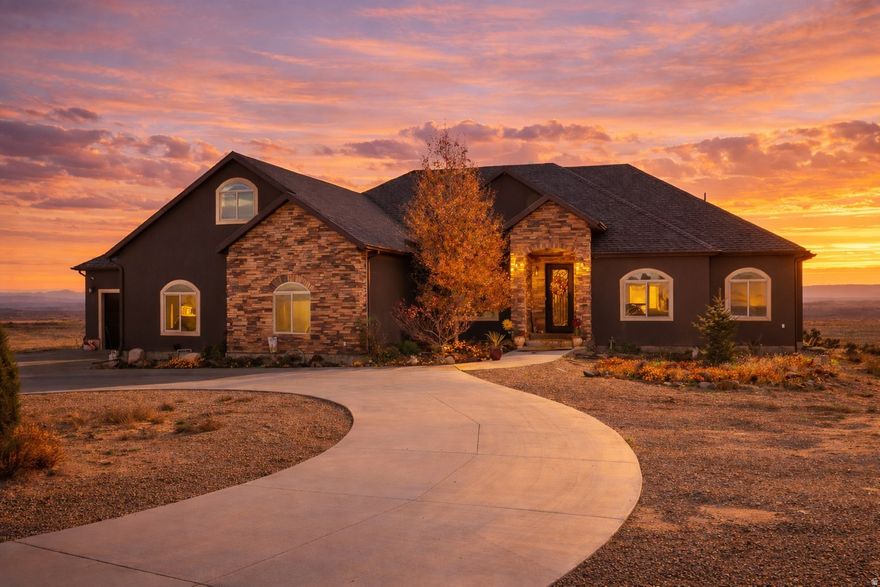 Rare Hill Top home overlooking iconic Pinnacle Peak! This stunning custom home sits on 10.66 acres in one of Carbon County's most prestigious locations. Featuring 4,493 sq ft, 6 bedrooms, 4 bathrooms, and a 4-car garage.  Enjoy an open floor plan, granite countertops, double wall ovens, pot filler, and custom tile work throughout. The fully finished walkout basement opens to a spacious patio, and a deck off the living room and master suite captures the breathtaking panoramic views. Additional highlights include a beautiful office with built-ins, a bonus room above the garage, central air with heat pump, cement circular driveway, and stunning architectural details. A truly once-in-a-lifetime property. Homes in this location rarely become available!  Square footage figures are provided as a courtesy estimate only.  Buyer is advised to obtain an independent measurement.