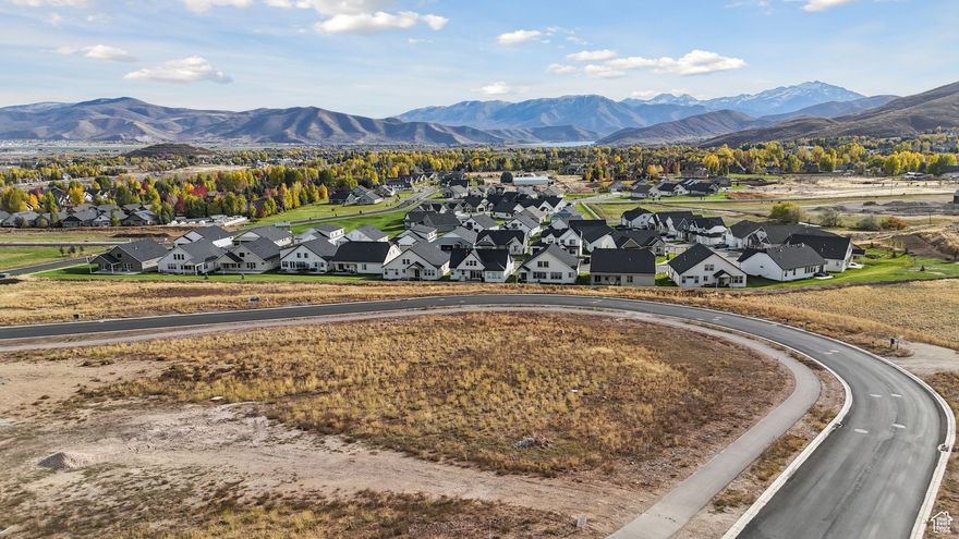 Lot #13. The Reserve is a fully designed and planned community consisting of 48 custom estate homesites surrounded by 30 acres of lush open space. Signature amenities include miles of walking trails, waterfalls, sports court, pool, viewing deck, and family gathering places. This breathtaking location boasts panoramic views of historic farms, Snake Creek Canyon, Deer Creek Reservoir, and the majestic Mount Timpanogos, while providing the exclusivity and serenity one desires in luxury living. This extraordinary opportunity only comes around once in a lifetime. Bring your own architect and designer! Watts Enterprises is the exclusive builder.