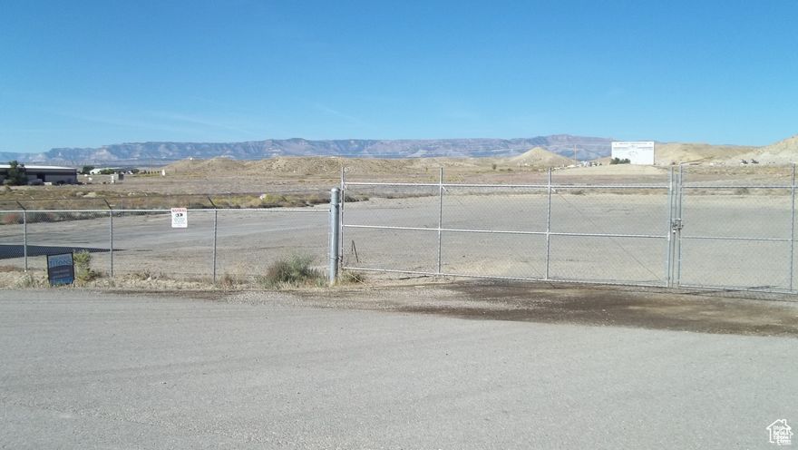 Great industrial property at a great price! This industrial lot was use as a trucking terminal. It is fully fenced with an 8' fence with barb wire all around and extra large double gate. Has cameras installed,220 power and water on site. Sewer is located outside of lot buyer to verify. There is a area that has blacktop and then 30 loads of road-a-mill brought in. Has a storage trailer on property. This commercial property is located in an industrial park just outside of city limits and just off Hwy 10 making it a great location for your business!!!