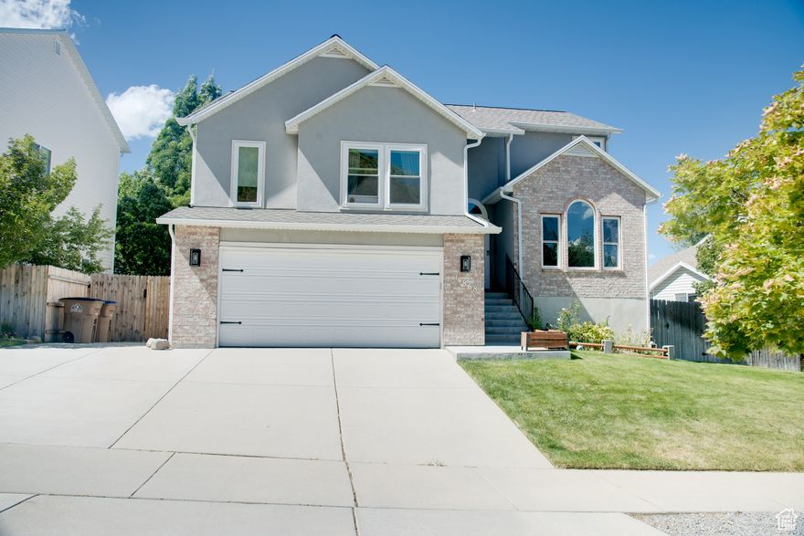 Discover the charm and elegance of this beautiful home nestled on the benches in Draper. Enjoy panoramic vistas of the majestic mountains right from your windows, providing a serene and picturesque backdrop. This residence offers a perfect blend of modern updates and classic comforts, making it an ideal sanctuary for any family.  Thoughtfully updated with contemporary touches that enhance both aesthetics and functionality. The kitchen has sleek granite countertops & tile backsplash, combining durability with timeless appeal. The modern kitchen comes complete with high-quality stainless steel appliances, perfect for culinary enthusiasts. You can experience the warmth and beauty of hardwood flooring that flows seamlessly throughout the living spaces. Rest assured with the security and efficiency of a recently installed roof, and newer windows throughout. Step outside to a fully landscaped yard that includes a garden, ideal for those with a green thumb, and host gatherings on the spacious deck, designed for entertaining friends and family. Conveniently located with quick access to the freeway, commuting is a breeze, and you can enjoy the convenience of being near a variety of shopping options for all your needs. Just steps away from trailhead access, explore mountain biking and hiking trails at your leisure, and a city park is just down the street, offering recreational opportunities for all ages. Get the kids off to school with ease, the bus stop is right across the street. Situated within the excellent Canyons School District, this home provides quality education options. Near 4 world class ski resorts, it's perfect for winter sports enthusiasts, and it's close to a premier flight park, offering thrilling adventures and stunning aerial views. This beautiful home on the Draper Bench offers a unique combination of luxury, convenience, and accessibility to nature, making it a truly exceptional place to call home. Buyer to verify all info. Sqft courtesy only. Easy to Show!