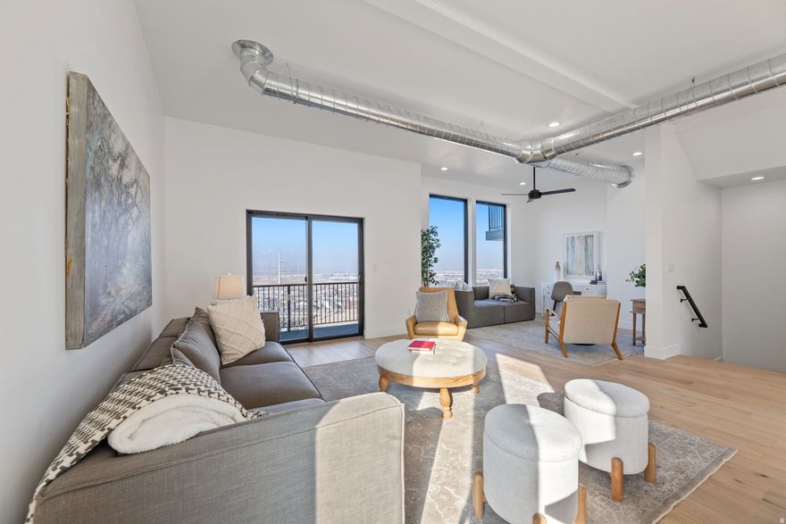 PREFERRED LENDER INCENTIVE! This stunning 2025-built row-end townhouse in highly desirable Draper offers panoramic valley views and modern elegance at its finest. Priced at $655,000, this 4-bedroom, 4-bath home spans ~2,554 sq ft with soaring 10' ceilings, premium LVP flooring, quartz countertops, custom soft-close cabinetry, black fixtures, tankless water heater, and a host of high-end upgrades throughout. Enjoy an open, efficient layout, an upstairs primary suite with private balcony and walk-in closet, plus a versatile lower-level bedroom suite with full bath and separate entrance-perfect for guests, office, or multi-gen living. Prime location near I-15 with breathtaking views. Seller is offering a 1% lender credit or a 1/0 temporary rate buy down when using the seller's preferred lender, subject to qualification and lender approval. This incentive is not available in combination with Utah Housing loans. Contact agent for full details.