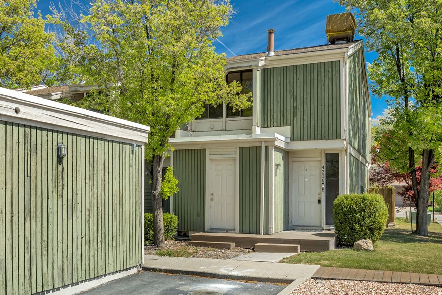 **Open House 4-11-26 11:00 am-1:00 Pm**  Cute, cozy, and perfectly located near freeways and shopping! This 2-bedroom townhome features updated flooring and fresh paint, making it feel clean, bright, and move-in ready. Step outside to an amazing deck-perfect for relaxing or entertaining-and enjoy the added convenience of a carport and extra storage in the crawlspace. This one has all the right touches... you won't want to miss it