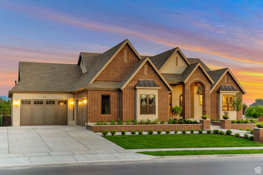 Discover refined living in this spacious and thoughtfully designed home, where every detail has been carefully curated for comfort and elegance. Boasting multiple en suite bathrooms, a walkout basement, and an open, airy floor plan, this property offers the perfect blend of luxury and livability. Step into the aesthetically pleasing kitchen, complete with high-end finishes including a 48" commercial-style gas range, and a spacious butler's pantry. Beautiful craft room or study nook adjacent to the kitchen. The family room stuns with a dramatic grid beam ceiling, stone fireplace, and rich stonework details visible throughout the home, creating a warm and inviting atmosphere. You'll love the Primary Suite featuring a dream closet and classy bathroom. Enjoy the outdoors like never before on the enormous wraparound deck, overlooking beautifully landscaped grounds, a sports court, and a pergola with fire pit. Walkout basement with a gorgeous kitchenette. The home also features a private gym with a mirrored wall and striking stone accent, an amazing laundry room with sink, and high-end finishes that highlight craftsmanship and attention to detail at every turn. This one-of-a-kind property blends elegance, functionality, and natural beauty.