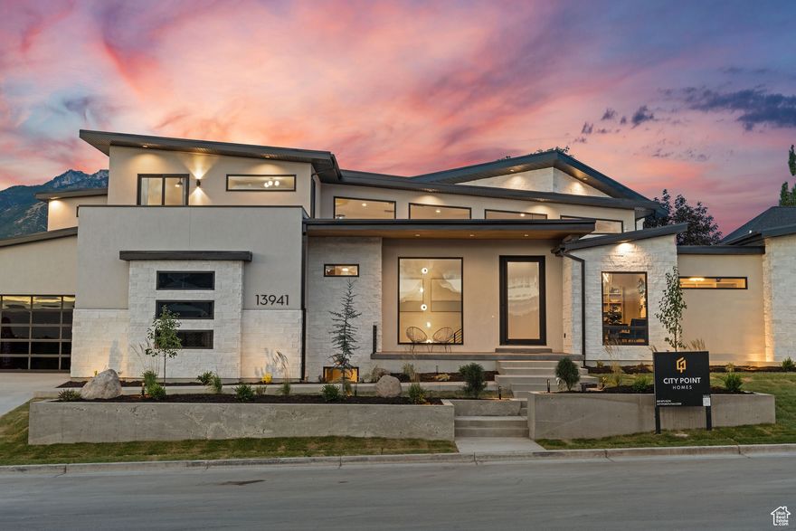 2025 PARADE OF HOMES AWARD WINNER! The latest offering from the award-winning design and build firm, City Point Homes, is now completed! This extraordinary custom home offers over 8,000 sq. ft. of modern luxury living. Featuring 6 spacious bedrooms, 7 luxurious bathrooms, and a massive 7-car garage, this estate is perfect for both entertaining and relaxation. Highlights include a stunning pool, a private pickleball court, a game room and an indoor sports court. The main living areas boast soaring ceilings up to 20 feet, a massive kitchen with an oversized island, a butler's pantry, and a huge covered patio. The finished basement offers a home gym, theater, bar, and rec room, while the upper balcony showcases breathtaking valley views. This home is truly a rare find in the heart of Draper!