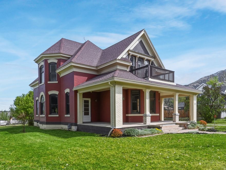 **Don't miss the attached "About Home" flyer** + Join us during our multi-day Open House to view "before" photos and explore a written history of this home's renovation journey** Step into timeless elegance with this beautifully restored 1899 Providence home where historic character meets modern comfort. Inside, you're greeted by 10-foot ceilings on the main level, 9-foot ceilings upstairs, original refinished wood floors, and three stunning bay windows accented with stained glass. Completely renovated, the kitchen offers ceiling-height cabinetry, stainless steel appliances, and quartz countertops. The inviting library features built-in bookshelves, a Cast Stone fireplace, and original pocket doors. The upstairs bathroom is a true showpiece, featuring beautiful imported Lincrusta and tile from England, paired with a classic clawfoot tub. Main-level bedroom with walk-in closet & attached ensuite bathroom. Outside, enjoy the charm of a large wraparound front porch and a generous (.77 acre) lot featuring a 15-tree, producing orchard; garden space & patio with a pergola. A rare opportunity to own a truly one-of-a-kind home.